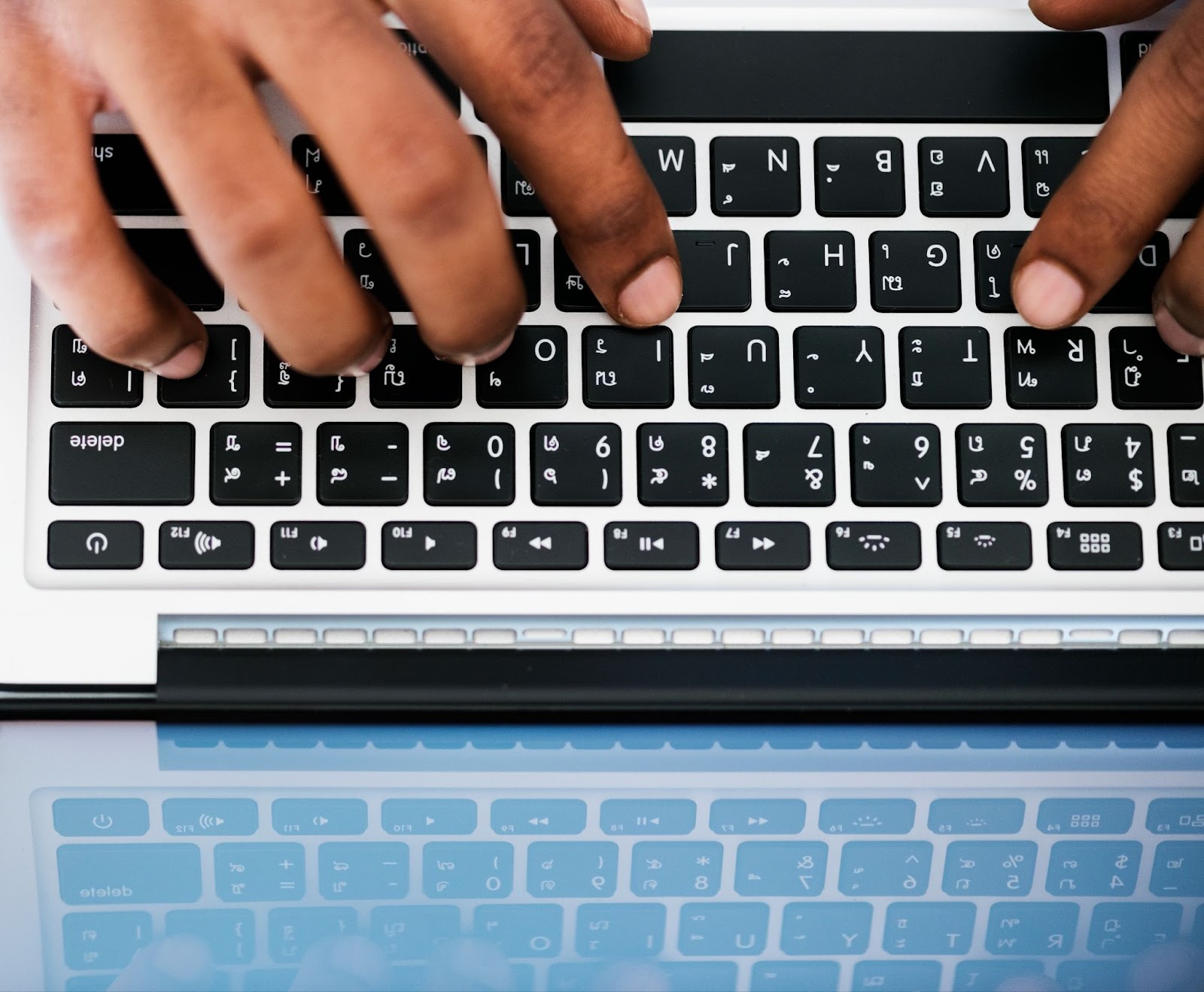 Top view of man using computer laptop at work