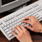 Top view of person using computer