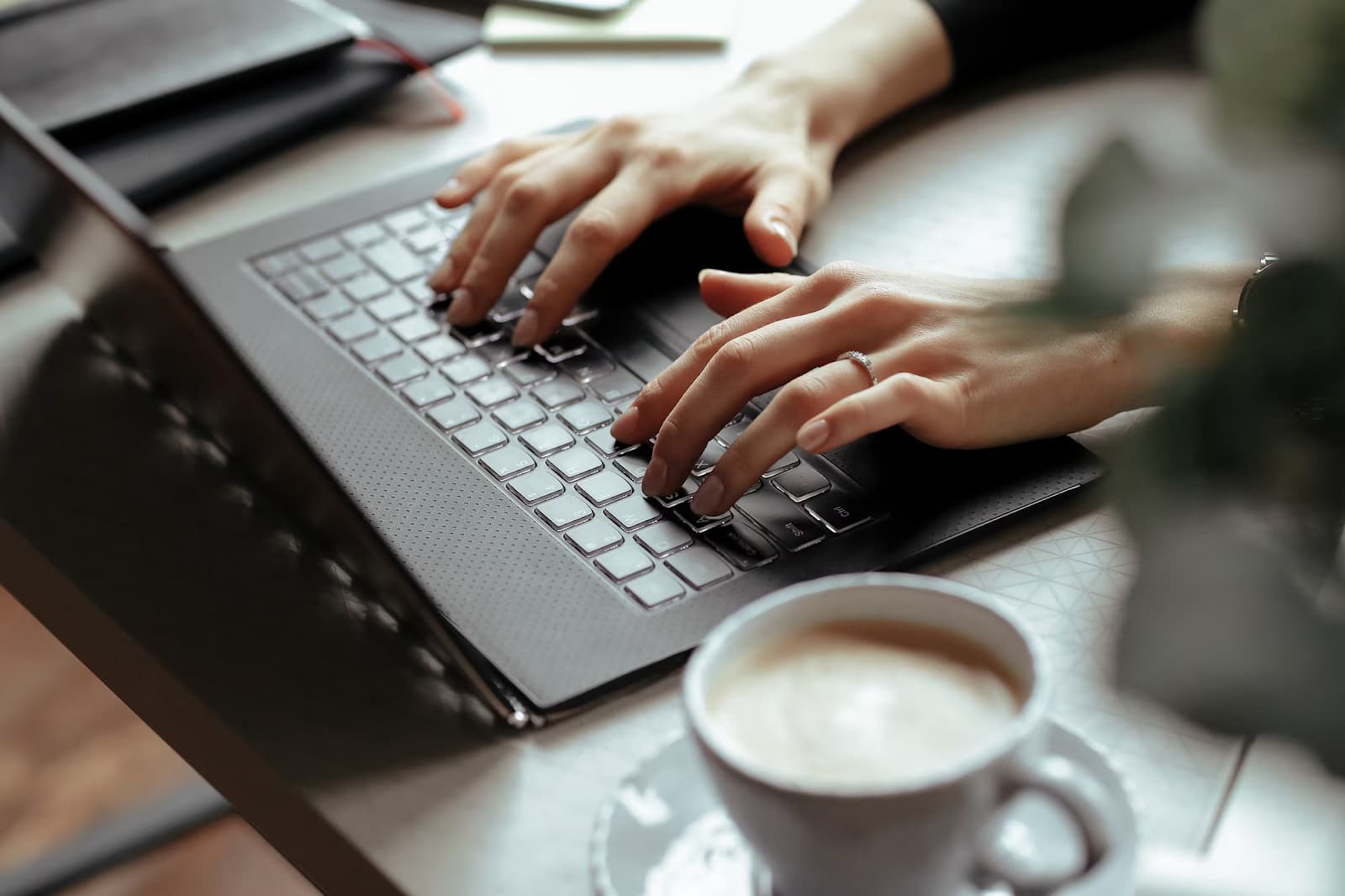 Man's hands typing on a keyboard